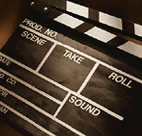 Classic film clapperboard with empty labels for production details, ready for use in a movie scene, emphasizing filmmaking processes.